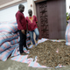Ivorian wildlife agents work on bags of pangolin scales they confiscated from traffickers in Abidjan, Ivory Coast, July 2017.